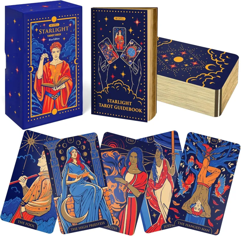 Wyspell Starlight Tarot — deep blue box, guidebook, and gilded-edge cards with cosmic artwork